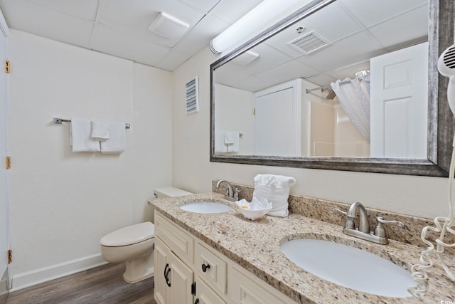 4800 S Ocean Blvd Unit 920, North Myrtle Beach, SC 29582 - full bath featuring a drop ceiling, wood finished floors, double vanity, and a shower with shower curtain