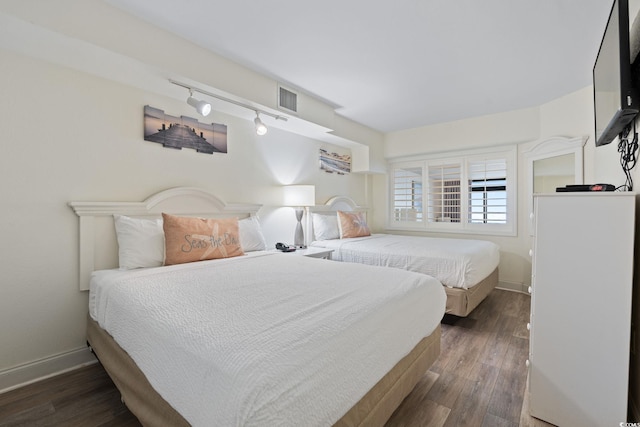 4800 S Ocean Blvd Unit 920, North Myrtle Beach, SC 29582 - bedroom with track lighting and wood finished floors