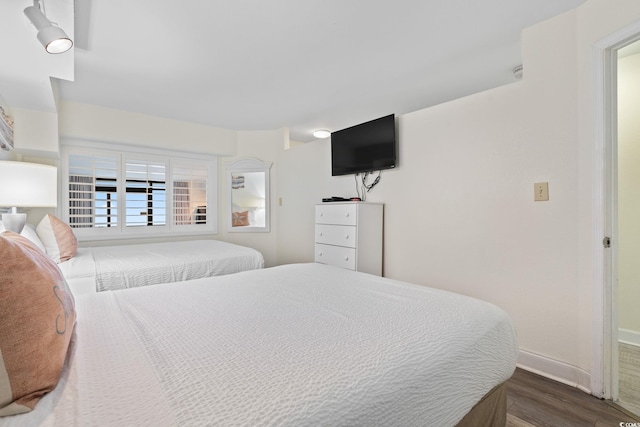 4800 S Ocean Blvd Unit 920, North Myrtle Beach, SC 29582 - bedroom featuring wood finished floors and baseboards