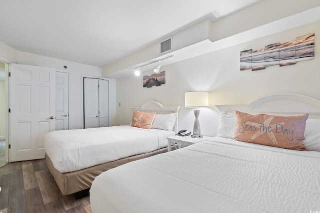 4800 S Ocean Blvd Unit 920, North Myrtle Beach, SC 29582 - bedroom featuring wood finished floors and rail lighting
