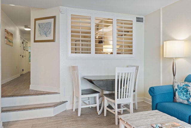 4800 S Ocean Blvd Unit 920, North Myrtle Beach, SC 29582 - dining room featuring baseboards and wood finished floors