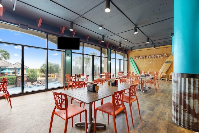 4800 S Ocean Blvd Unit 920, North Myrtle Beach, SC 29582 - dining area featuring a wall of windows and wood finished floors