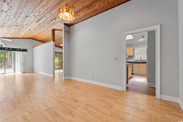 149 Old Cedar Loop, Pawleys Island, SC 29585 - unfurnished living room with light wood-style flooring, vaulted ceiling, and wooden ceiling