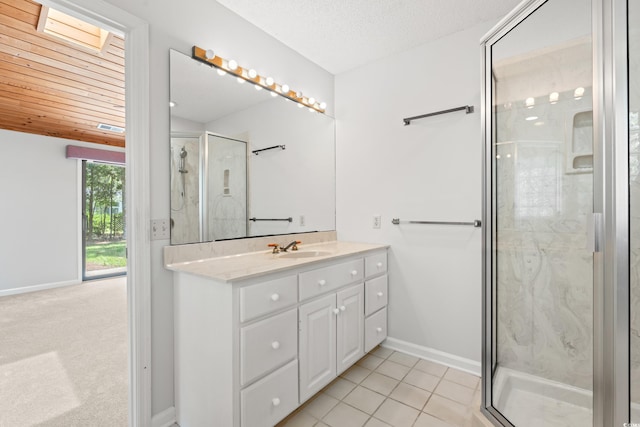 149 Old Cedar Loop, Pawleys Island, SC 29585 - bathroom with a marble finish shower, vanity, and tile patterned flooring