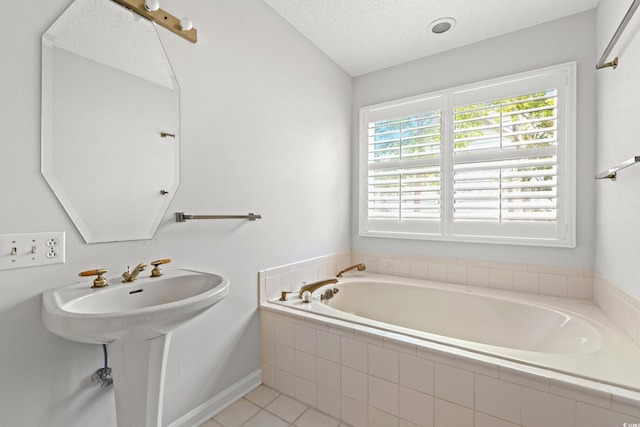 149 Old Cedar Loop, Pawleys Island, SC 29585 - bathroom with a garden tub, a textured ceiling, and tile patterned floors