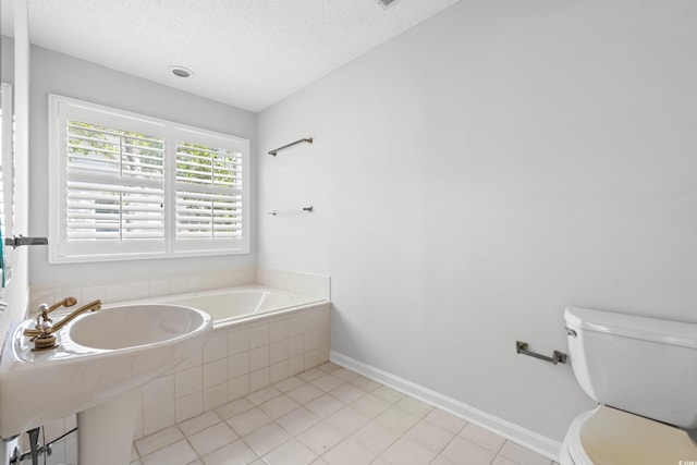 149 Old Cedar Loop, Pawleys Island, SC 29585 - bathroom featuring tile patterned floors, a textured ceiling, and a garden tub