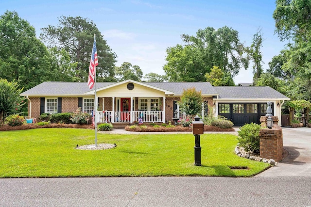 280 Morgan Ave, Little River, SC 29566 - ranch-style house featuring covered porch, a front lawn, and brick siding