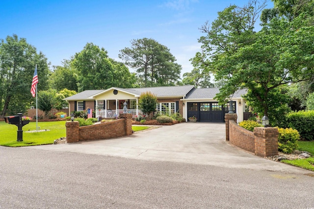 280 Morgan Ave, Little River, SC 29566 - ranch-style house featuring concrete driveway, a porch, and brick siding