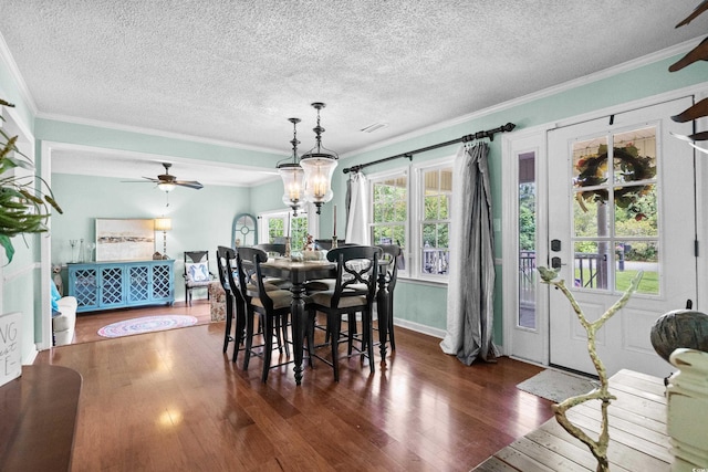 280 Morgan Ave, Little River, SC 29566 - dining space with ceiling fan, hardwood / wood-style flooring, crown molding, a textured ceiling, and a chandelier