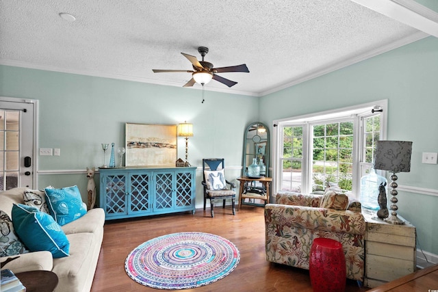 280 Morgan Ave, Little River, SC 29566 - living room with ornamental molding, ceiling fan, wood finished floors, and a textured ceiling