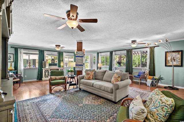 280 Morgan Ave, Little River, SC 29566 - living room with ceiling fan, healthy amount of natural light, wood finished floors, and a textured ceiling