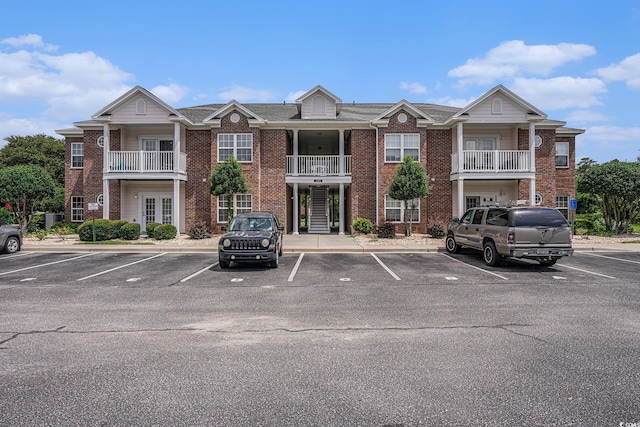 2005 Silvercrest Dr Unit 32F, Myrtle Beach, SC 29579 - view of building exterior featuring uncovered parking