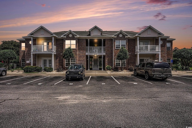 2005 Silvercrest Dr Unit 32F, Myrtle Beach, SC 29579 - property at dusk featuring uncovered parking