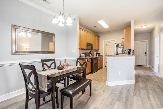 2005 Silvercrest Dr Unit 32F, Myrtle Beach, SC 29579 - dining space featuring light wood-style flooring, a chandelier, and ornamental molding