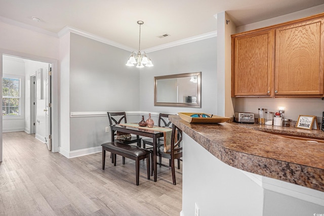 2005 Silvercrest Dr Unit 32F, Myrtle Beach, SC 29579 - dining area with crown molding, light wood-type flooring, and a chandelier