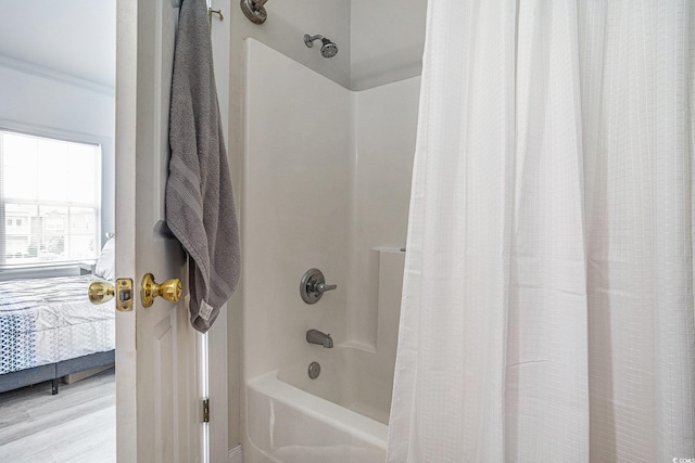 2005 Silvercrest Dr Unit 32F, Myrtle Beach, SC 29579 - ensuite bathroom featuring shower / bathtub combination with curtain and wood finished floors