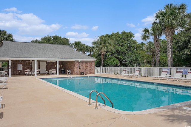 2005 Silvercrest Dr Unit 32F, Myrtle Beach, SC 29579 - community pool featuring a patio and view of scattered trees