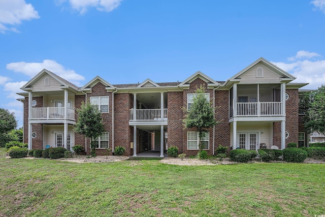 2005 Silvercrest Dr Unit 32F, Myrtle Beach, SC 29579 - neoclassical home with brick siding, a front lawn, and french doors