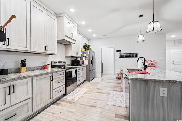 4486 Bethel Rd, Aynor, SC 29511 - kitchen with stainless steel appliances, a center island with sink, recessed lighting, light wood finished floors, and pendant lighting