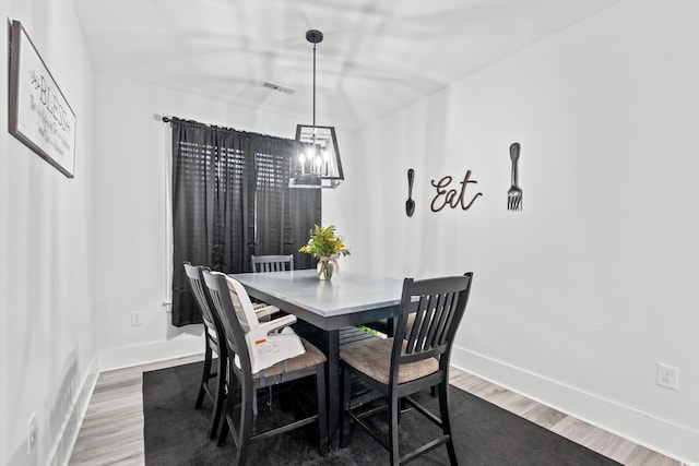4486 Bethel Rd, Aynor, SC 29511 - dining space with wood finished floors and a chandelier