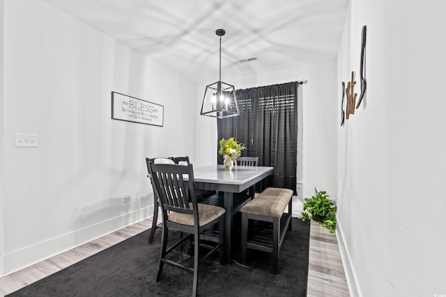 4486 Bethel Rd, Aynor, SC 29511 - dining space featuring wood finished floors and a chandelier