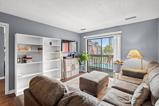 7700 Porcher Dr Unit 3205, Myrtle Beach, SC 29572 - living area featuring wood finished floors and a textured ceiling