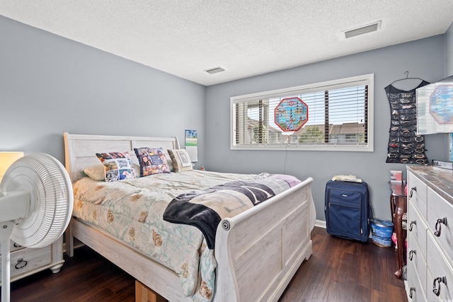7700 Porcher Dr Unit 3205, Myrtle Beach, SC 29572 - bedroom featuring dark wood finished floors and a textured ceiling