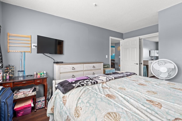 7700 Porcher Dr Unit 3205, Myrtle Beach, SC 29572 - bedroom with wood finished floors and a textured ceiling