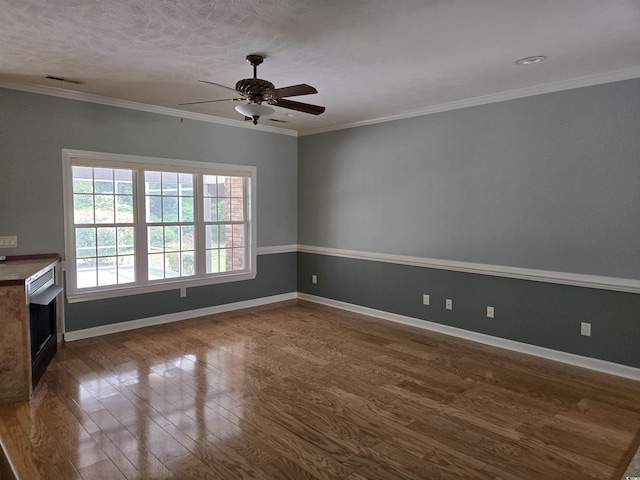 6542 Wellington Dr, Murrells Inlet, SC 29576 - empty room with ceiling fan, dark wood-style flooring, a fireplace, and ornamental molding