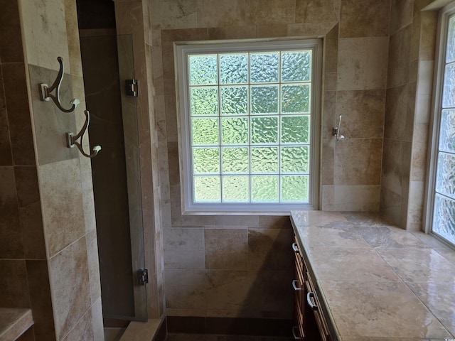 6542 Wellington Dr, Murrells Inlet, SC 29576 - bathroom featuring healthy amount of natural light, a tile shower, and vanity