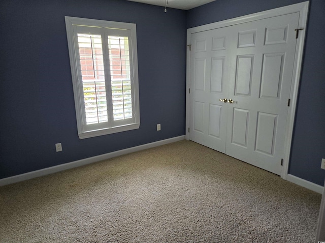 6542 Wellington Dr, Murrells Inlet, SC 29576 - unfurnished bedroom with carpet floors, multiple windows, and a closet