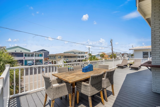 204 55th Ave N, North Myrtle Beach, SC 29582 - wooden terrace with a residential view and outdoor dining space