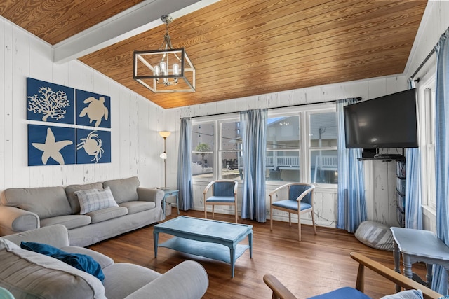 204 55th Ave N, North Myrtle Beach, SC 29582 - living room featuring wood ceiling, a chandelier, wood finished floors, and wooden walls