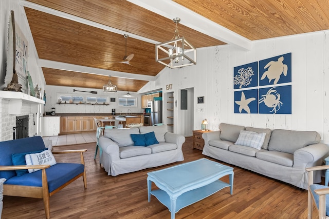 204 55th Ave N, North Myrtle Beach, SC 29582 - living area featuring wooden ceiling, a chandelier, wood finished floors, and a fireplace
