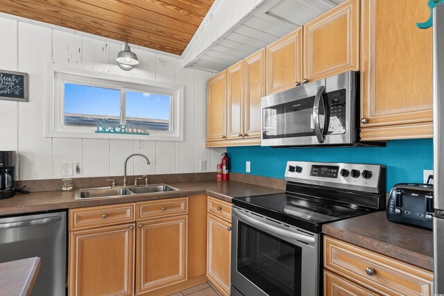204 55th Ave N, North Myrtle Beach, SC 29582 - kitchen with appliances with stainless steel finishes, dark countertops, and wooden ceiling