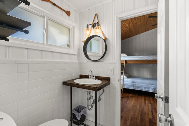 204 55th Ave N, North Myrtle Beach, SC 29582 - half bath featuring tile walls and hardwood / wood-style flooring