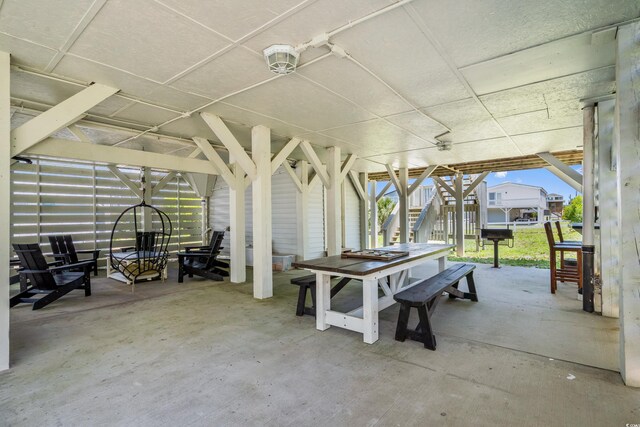 204 55th Ave N, North Myrtle Beach, SC 29582 - view of patio featuring stairs and outdoor dining space