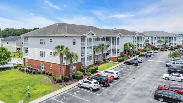 4142 Hibiscus Dr Unit 102, Little River, SC 29566 - view of property featuring uncovered parking and a residential view