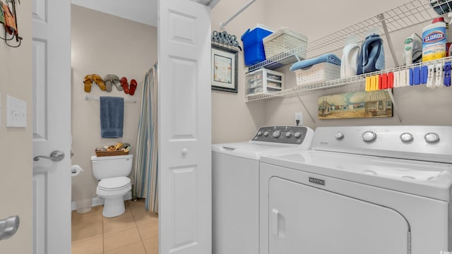 4142 Hibiscus Dr Unit 102, Little River, SC 29566 - washroom featuring washing machine and clothes dryer and light tile patterned flooring