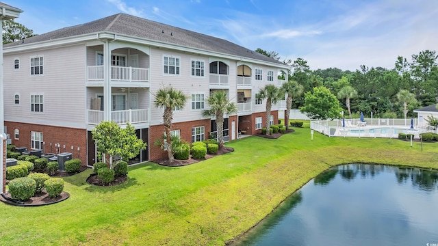 4142 Hibiscus Dr Unit 102, Little River, SC 29566 - view of building exterior with a water view