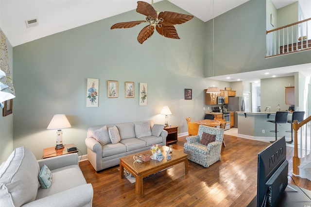 100 Culpepper Way Unit 1003, Myrtle Beach, SC 29579 - living room with high vaulted ceiling, a ceiling fan, wood finished floors, and stairway