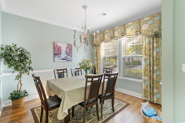 100 Culpepper Way Unit 1003, Myrtle Beach, SC 29579 - dining space with ornamental molding, a chandelier, and wood finished floors