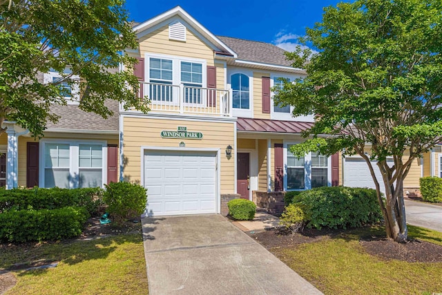 100 Culpepper Way Unit 1003, Myrtle Beach, SC 29579 - view of front facade with driveway, an attached garage, a standing seam roof, a balcony, and a metal roof