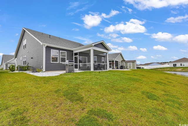 1898 Moonseed Dr, Longs, SC 29568 - back of house featuring a sunroom and a lawn