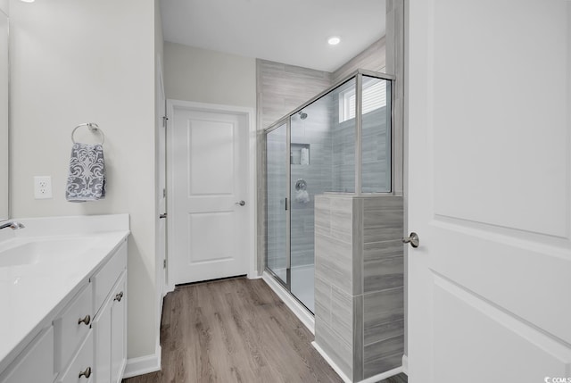 1898 Moonseed Dr, Longs, SC 29568 - full bathroom featuring a stall shower, vanity, and wood finished floors
