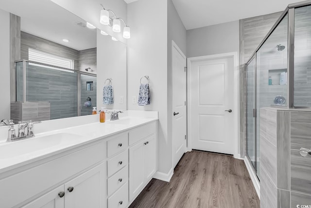 1898 Moonseed Dr, Longs, SC 29568 - full bath featuring double vanity, a stall shower, and wood finished floors
