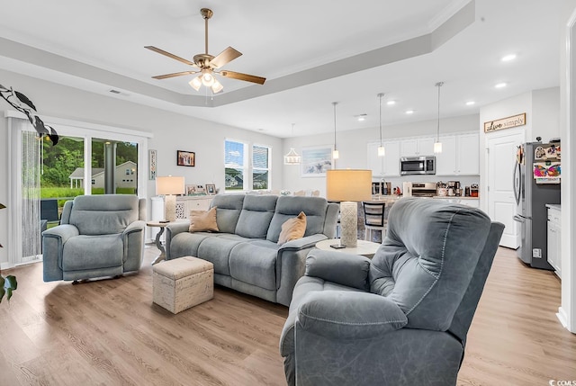 1898 Moonseed Dr, Longs, SC 29568 - living area with a ceiling fan, recessed lighting, light wood finished floors, and a raised ceiling