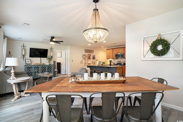 247GROVEPARK Grove Park Loop, Murrells Inlet, SC 29576 - dining space with light wood finished floors, ceiling fan, a chandelier, and recessed lighting