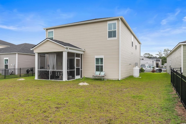 1078 Saltgrass Way, Myrtle Beach, SC 29588 - rear view of house with a sunroom and a fenced backyard