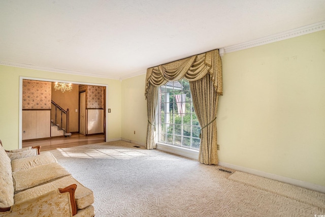 4920 Meadow St, Loris, SC 29569 - unfurnished living room featuring stairs, ornamental molding, carpet flooring, and a chandelier